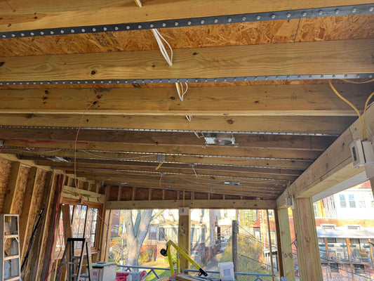 Nolan Roof Rafter Strengthening Strap installed from the attic along a wood rafter