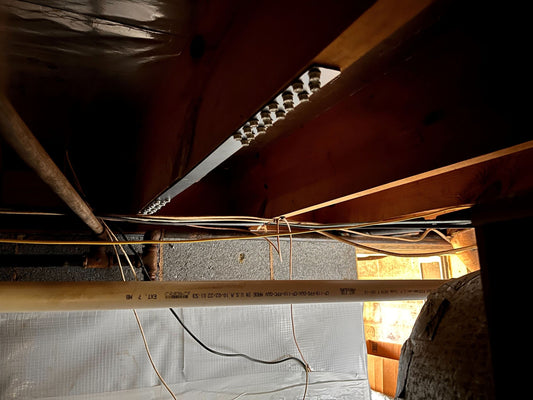 Nolan Joist Repair Kit installed beneath a floor joist