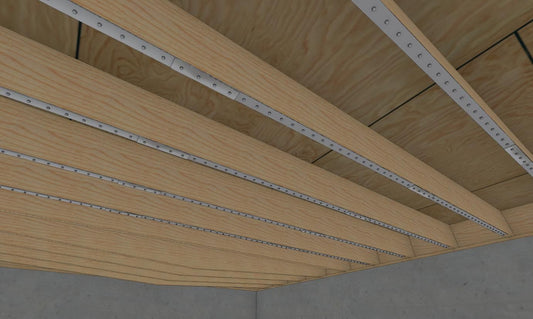 Nolan Floor Joist Stiffening Strap System installed along wood floor joists to reduce bounce and deflection