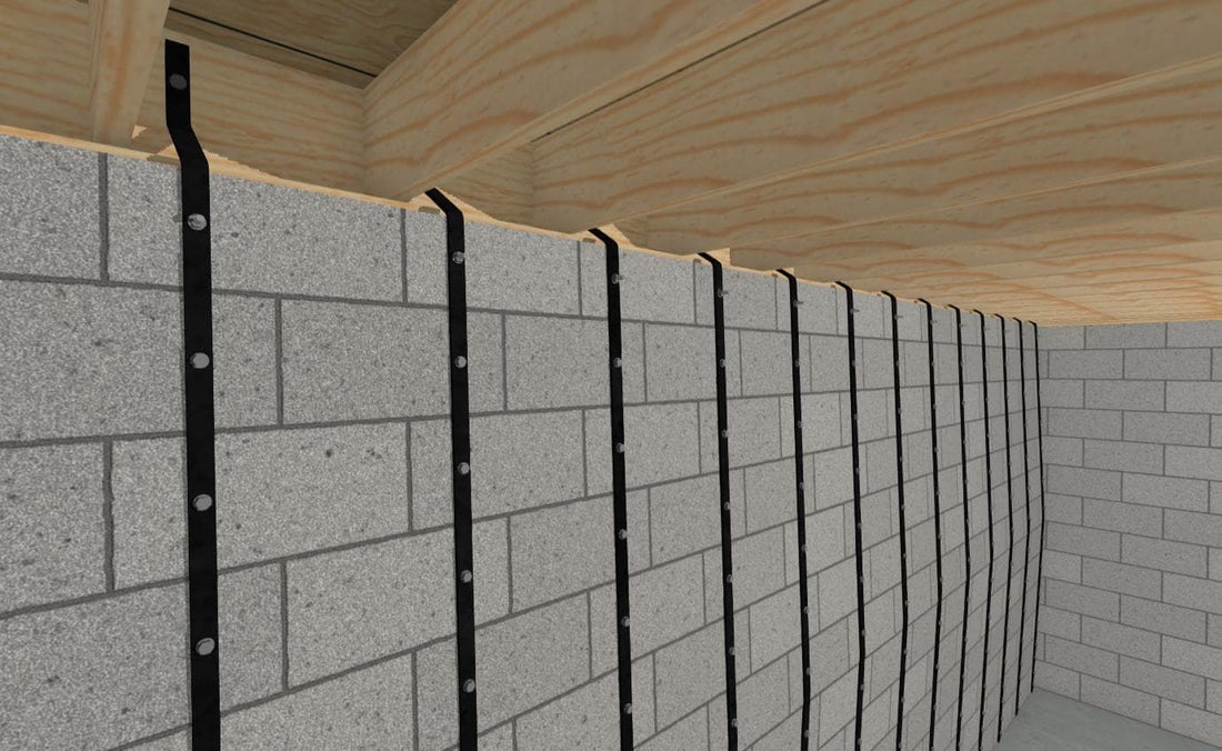 Basement Wall Straps fastened vertically to a concrete-block foundation wall beneath floor framing